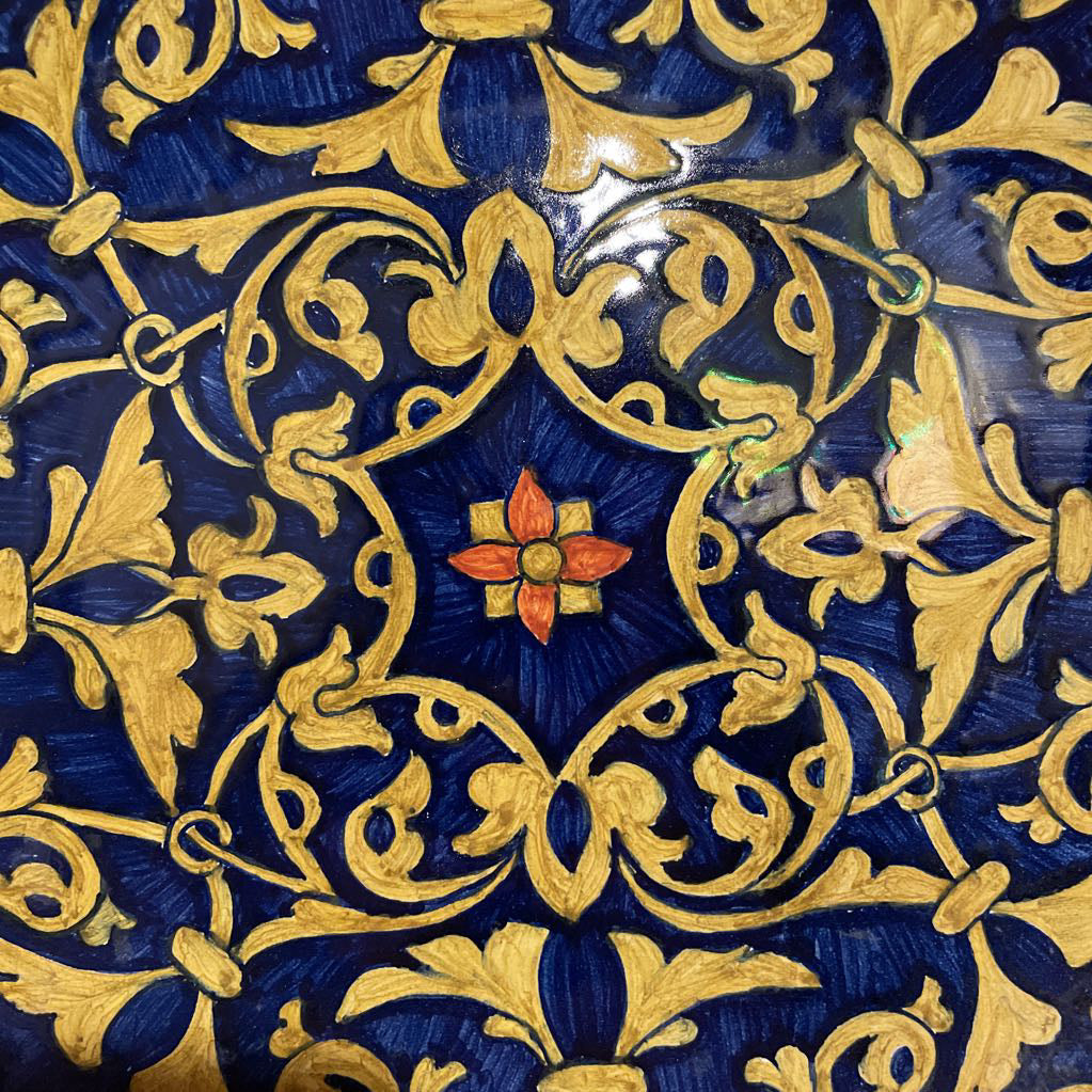 Blue Plate with Dark Gold/Yellow Pattern and Center Flower Detail