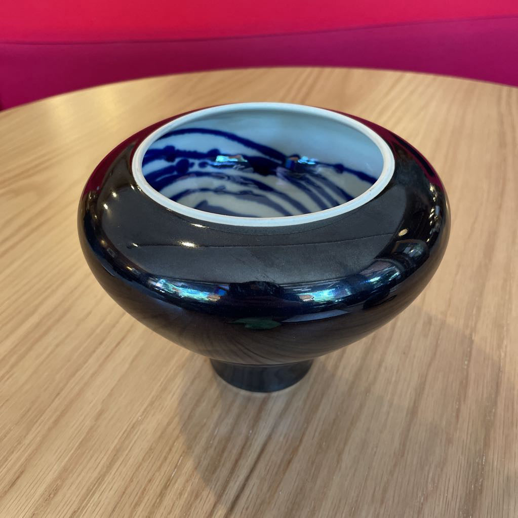 Black Vase with White and Blue Swirl Interior
