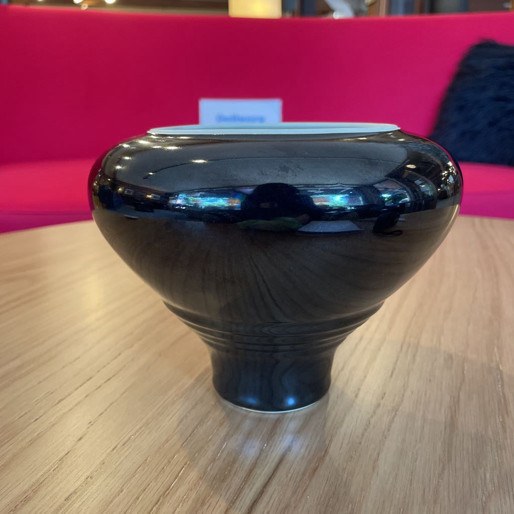 Black Vase with White and Blue Swirl Interior