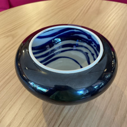 Black Vase with White and Blue Swirl Interior