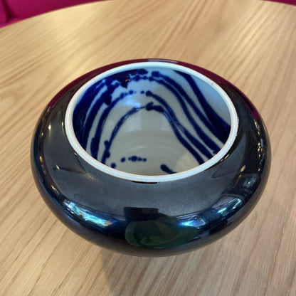 Black Vase with White and Blue Swirl Interior