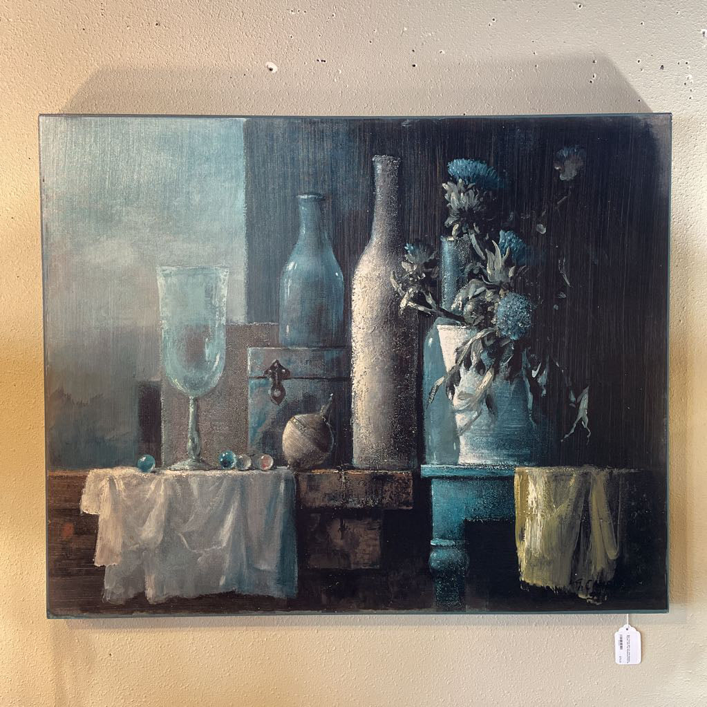 Blue Tinted Still Life With Bottles, Florals, and Top Numbered Print