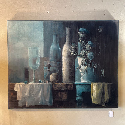 Blue Tinted Still Life With Bottles, Florals, and Top Numbered Print