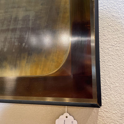 Large Metallic Art Featuring Wheel and Symbols