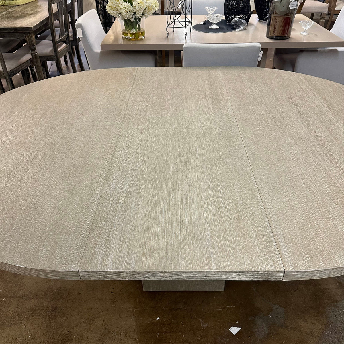Bernhardt Loggia Round Dining Table with 20-Inch Extension Leaf in Aria Oak